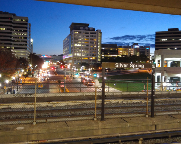 Image of downtown Silver Spring at night from the Metro platform.